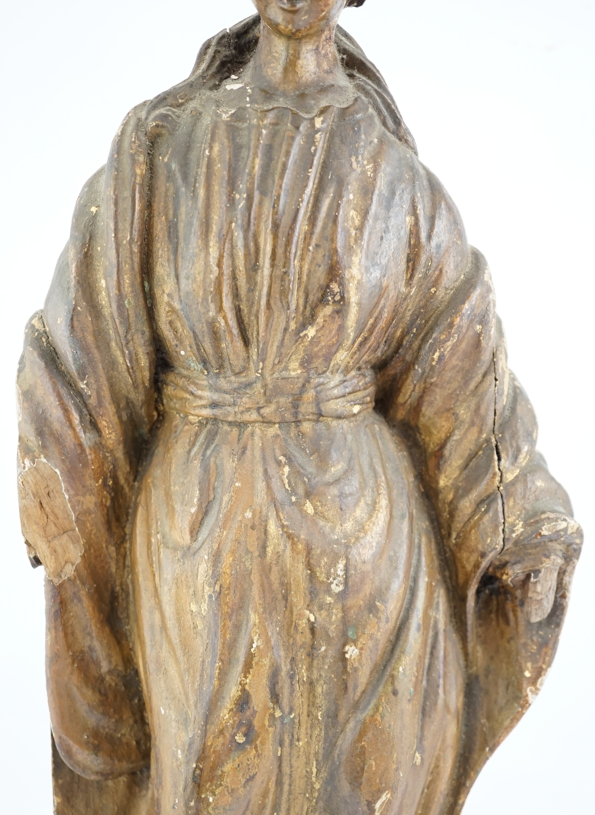 An 18th century Continental carved wood figure of a female saint